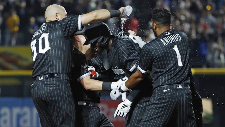 Jun 9, 2023; Chicago, Illinois, USA; Chicago White Sox center fielder Luis Robert Jr. (center) celebrates with teammates after hitting a walk-off single against the Miami Marlins during the ninth inning at Guaranteed Rate Field. Mandatory Credit: Kamil Krzaczynski-USA TODAY Sports