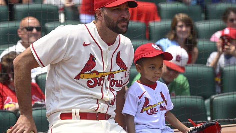 Jun 10, 2023; St. Louis, Missouri, USA; St. Louis Cardinals starting pitcher Adam Wainwright (50) and his son Caleb look on prior to a ceremonial first pitch before a game against the Cincinnati Reds at Busch Stadium. Mandatory Credit: Joe Puetz-USA TODAY Sports