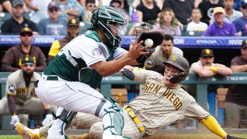 Jun 10, 2023; Denver, Colorado, USA; San Diego Padres second baseman Ha-Seong Kim (7) scores against Colorado Rockies catcher Elias Diaz (35) in the sixth inning at Coors Field. Mandatory Credit: Ron Chenoy-USA TODAY Sports