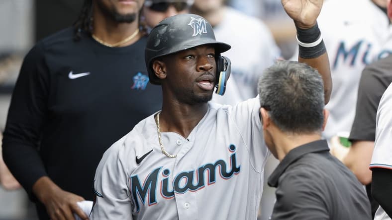 Jun 10, 2023; Chicago, Illinois, USA; Miami Marlins center fielder Jonathan Davis (49) celebrates with teammates after scoring against the Chicago White Sox during the ninth inning at Guaranteed Rate Field. Mandatory Credit: Kamil Krzaczynski-USA TODAY Sports