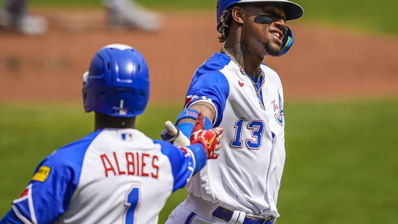 Jun 10, 2023; Cumberland, Georgia, USA; Atlanta Braves right fielder Ronald Acuna Jr. (13) reacts with second baseman Ozzie Albies (1) after scoring a run against the Washington Nationals during the first inning at Truist Park. Mandatory Credit: Dale Zanine-USA TODAY Sports