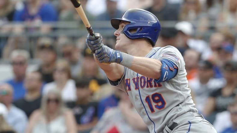 Jun 10, 2023; Pittsburgh, Pennsylvania, USA; New York Mets first baseman Mark Canha (19) hits a two run double against the Pittsburgh Pirates during the seventh inning at PNC Park. Mandatory Credit: Charles LeClaire-USA TODAY Sports
