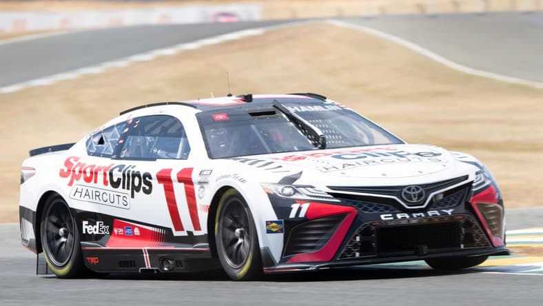 Jun 10, 2023; Sonoma, California, USA; NASCAR Cup Series driver Denny Hamlin (11) performs a practice lap before qualifications at Sonoma Raceway. Mandatory Credit: Stan Szeto-USA TODAY Sports