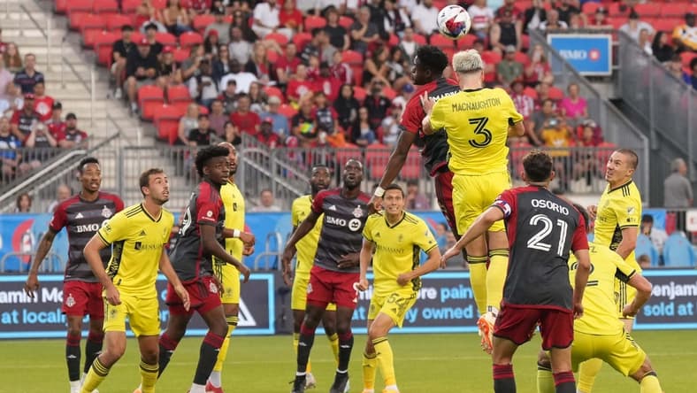 Jun 10, 2023; Toronto, Ontario, CAN;Nashville SC defender Lukas MacNaughton (3) jumps for the header  at BMO Field. Mandatory Credit: Nick Turchiaro-USA TODAY Sports