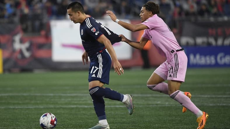 Jun 10, 2023; Foxborough, Massachusetts, USA; New England Revolution forward Bobby Wood (17) runs with the ball ahead of Inter Miami midfielder David Ruiz (41) during the first half at Gillette Stadium. Mandatory Credit: Bob DeChiara-USA TODAY Sports