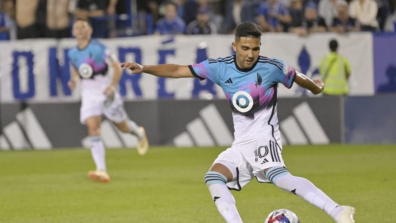 Jun 10, 2023; Montreal, Quebec, CAN; Minnesota United midfielder Emanuel Reynoso (10) plays the ball in the second half against the CF Montreal at Stade Saputo. Mandatory Credit: Eric Bolte-USA TODAY Sports