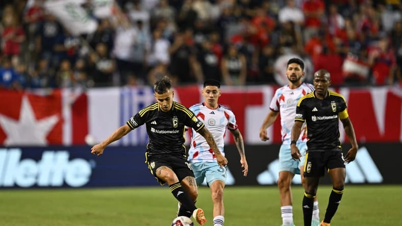 June 10, 2023; Chicago, Illinois, USA; Columbus Crew midfielder Lucas Zelarrayan (10) takes control of the ball in front of Chicago Fire midfielder Federico Navarro (31) in the second half at Soldier Field. Mandatory Credit: Jamie Sabau-USA TODAY Sports