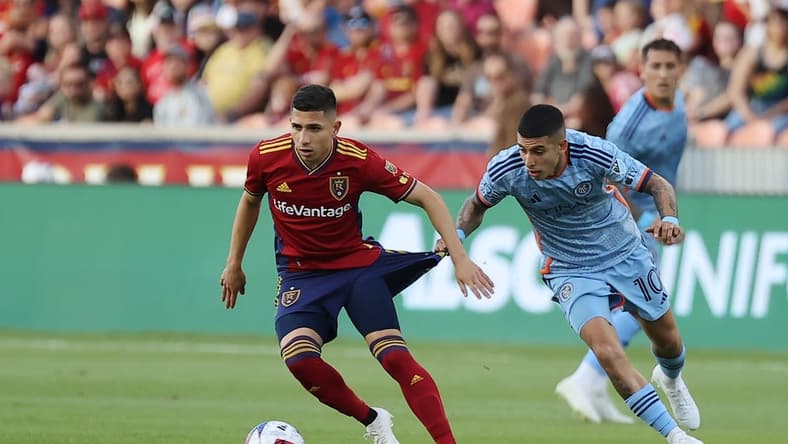 Jun 10, 2023; Sandy, Utah, USA; Real Salt Lake forward Jefferson Savarino (10) dribbles the ball against New York City FC midfielder Santiago Rodr guez (10 in the first half at America First Field. Mandatory Credit: Rob Gray-USA TODAY Sports