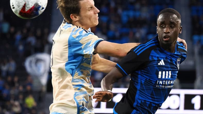 Jun 10, 2023; San Jose, California, USA; San Jose Earthquakes midfielder Jamiro Monteiro (35) heads the ball against Philadelphia Union defender Jack Elliott (3) during the first half at PayPal Park. Mandatory Credit: Kelley L Cox-USA TODAY Sports