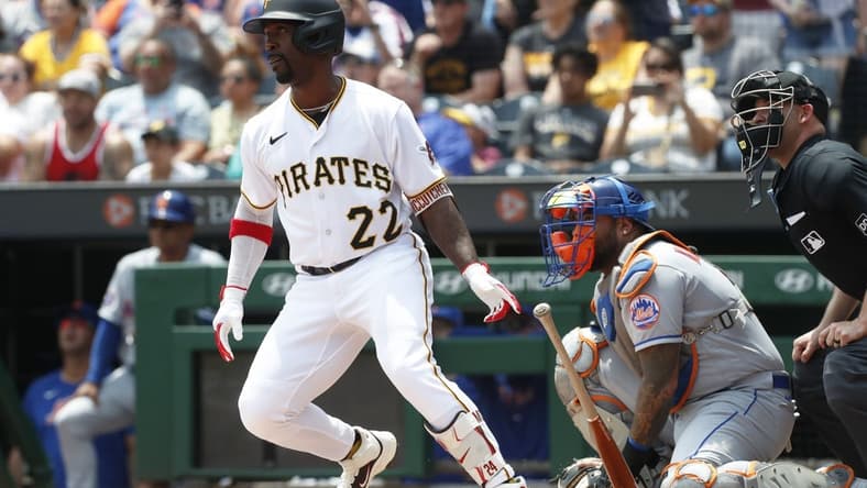 Jun 11, 2023; Pittsburgh, Pennsylvania, USA; Pittsburgh Pirates designated hitter Andrew McCutchen (22) hits a single to register his 2000th career major league hit during the first inning against the New York Mets at PNC Park. Mandatory Credit: Charles LeClaire-USA TODAY Sports