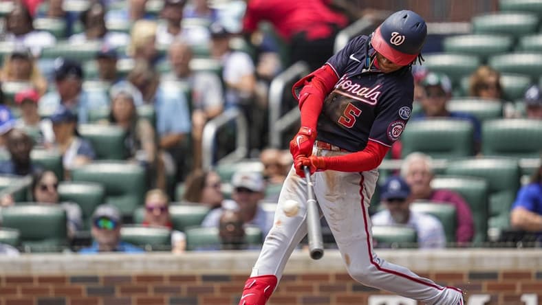 Jun 11, 2023; Cumberland, Georgia, USA; Washington Nationals shortstop CJ Abrams (5) singles against the Atlanta Braves during the third inning at Truist Park. Mandatory Credit: Dale Zanine-USA TODAY Sports