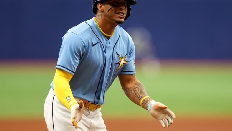 Jun 11, 2023; St. Petersburg, Florida, USA; Tampa Bay Rays shortstop Wander Franco (5) celebrates after hitting a three run home run against the Texas Rangers in the fourth inning at Tropicana Field. Mandatory Credit: Nathan Ray Seebeck-USA TODAY Sports