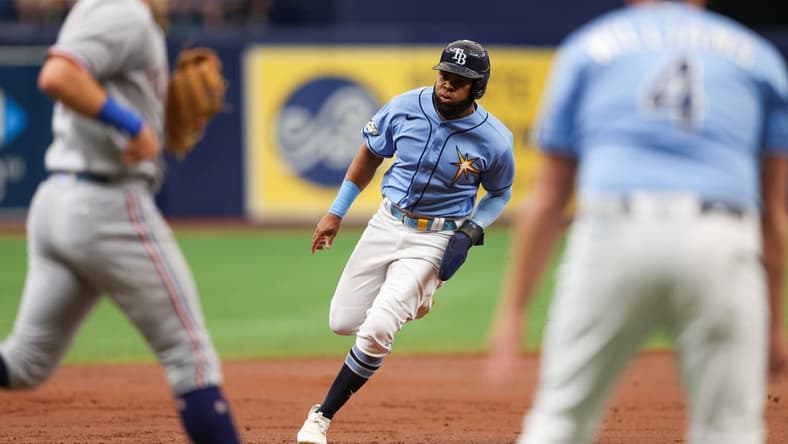 Jun 11, 2023; St. Petersburg, Florida, USA; Tampa Bay Rays right fielder Manuel Margot (13) rounds third base to score a run against the Texas Rangers in the second inning at Tropicana Field. Mandatory Credit: Nathan Ray Seebeck-USA TODAY Sports