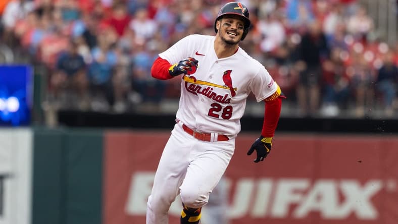 Jun 11, 2023; St. Louis, Missouri, USA; St. Louis Cardinals Nolan Arenado (28) hits a triple in the third inning against the Cincinatti Reds at Busch Stadium. Mandatory Credit: Zach Dalin-USA TODAY Sports