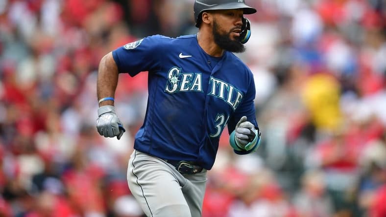 June 11, 2023; Anaheim, California, USA; Seattle Mariners right fielder Teoscar Hernandez (35) runs after hitting a single against the Los Angeles Angels during the sixth inning at Angel Stadium. Mandatory Credit: Gary A. Vasquez-USA TODAY Sports