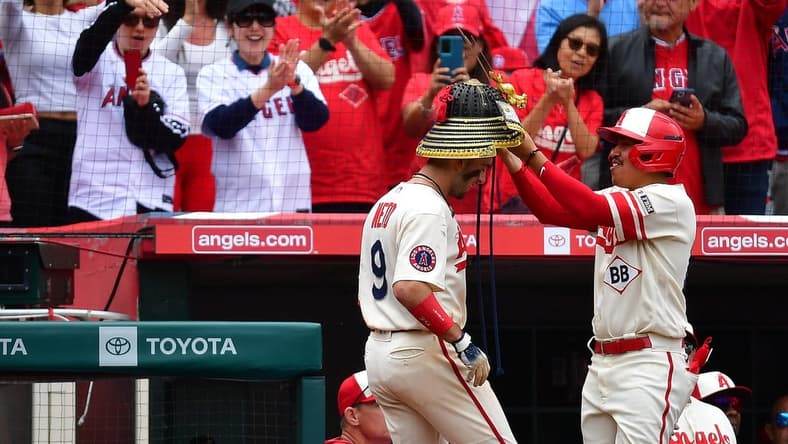 June 11, 2023; Anaheim, California, USA; Los Angeles Angels shortstop Zach Neto (9) receives the kabuto helmet after hitting a solo home run against the Seattle Mariners during the eighth inning at Angel Stadium. Mandatory Credit: Gary A. Vasquez-USA TODAY Sports