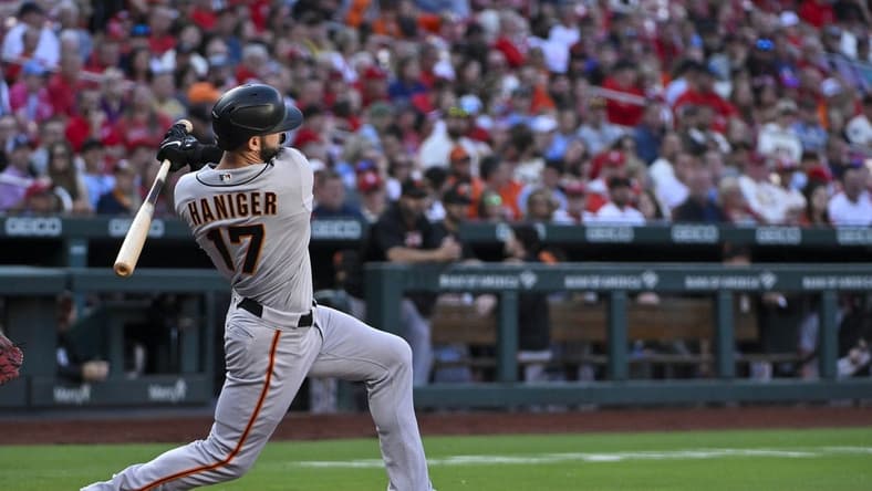 Jun 12, 2023; St. Louis, Missouri, USA; San Francisco Giants left fielder Mitch Haniger (17) hits a one run double against the St. Louis Cardinals during the third inning at Busch Stadium. Mandatory Credit: Jeff Curry-USA TODAY Sports