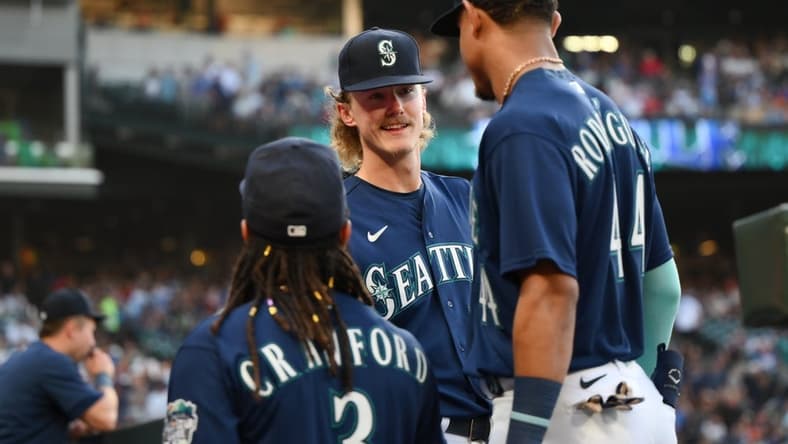 Jun 12, 2023; Seattle, Washington, USA; Seattle Mariners starting pitcher Bryce Miller (50) talks with shortstop J.P. Crawford (3) and center fielder Julio Rodriguez (44) during the seventh inning against the Miami Marlins at T-Mobile Park. Mandatory Credit: Steven Bisig-USA TODAY Sports