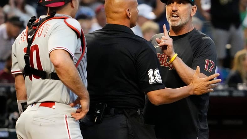 Jun 12, 2023; Phoenix, AZ, USA; Arizona Diamondbacks manager Torey Lovullo (17) urges with Philadelphia Phillies catcher J.T. Realmuto (10) after Corbin Carroll was hit by a pitch for the second time in the game in the third inning at Chase Field. Mandatory Credit: Rob Schumacher-Arizona Republic