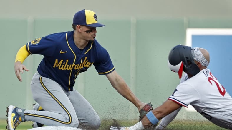 Jun 13, 2023; Minneapolis, Minnesota, USA; Milwaukee Brewers shortstop Willy Adames (27) tags out Minnesota Twins third baseman Royce Lewis (23) who tried to extend a single into a double in the second inning at Target Field. Mandatory Credit: Bruce Kluckhohn-USA TODAY Sports