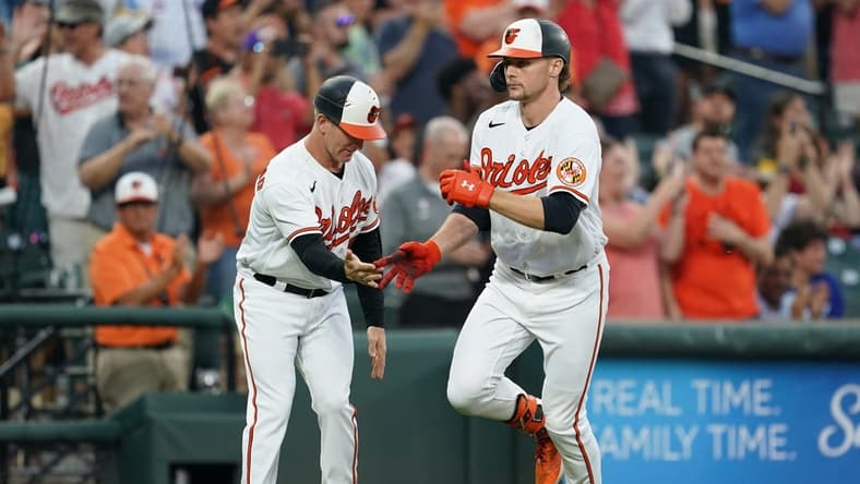 Jun 13, 2023; Baltimore, Maryland, USA; Baltimore Orioles designated hitter Gunnar Henderson (2) is greeted by coach Tony Mansolino (36) following his third inning grand slam against the Toronto Blue Jays at Oriole Park at Camden Yards. Mandatory Credit: Mitch Stringer-USA TODAY Sports