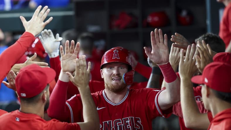 Jun 13, 2023; Arlington, Texas, USA; Los Angeles Angels catcher Chad Wallach (35) celebrates with teammates after scoring during the third inning against the Texas Rangers at Globe Life Field. Mandatory Credit: Kevin Jairaj-USA TODAY Sports
