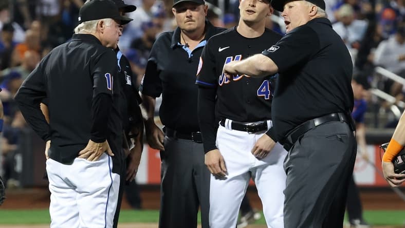 Jun 13, 2023; New York City, New York, USA; New York Mets relief pitcher Drew Smith (40) is ejected by umpire Bill Miller (26) during the seventh inning against the New York Yankees at Citi Field. Mandatory Credit: Vincent Carchietta-USA TODAY Sports