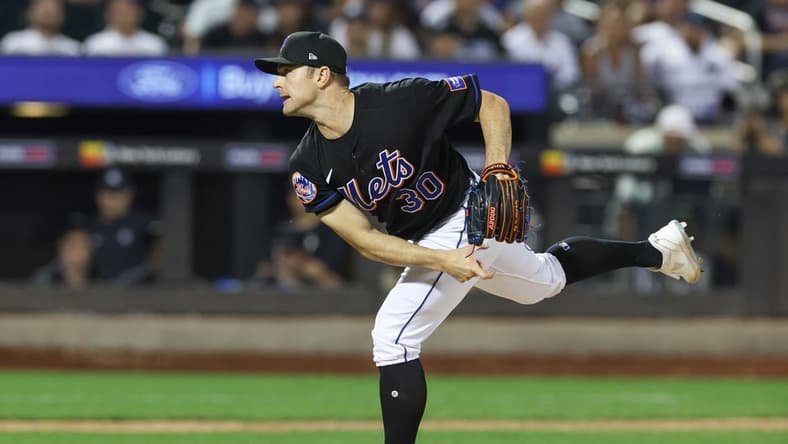 Jun 13, 2023; New York City, New York, USA; New York Mets relief pitcher David Robertson (30) delivers a pitch  during the ninth inning against the New York Yankees at Citi Field. Mandatory Credit: Vincent Carchietta-USA TODAY Sports