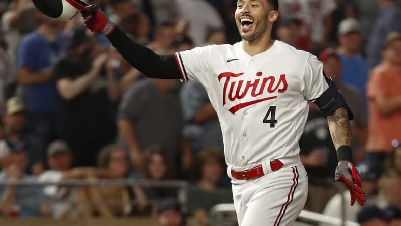 Jun 13, 2023; Minneapolis, Minnesota, USA; Minnesota Twins shortstop Carlos Correa (4) celebrates his two-run home run to beat the Milwaukee Brewers in the ninth inning at Target Field. Mandatory Credit: Bruce Kluckhohn-USA TODAY Sports