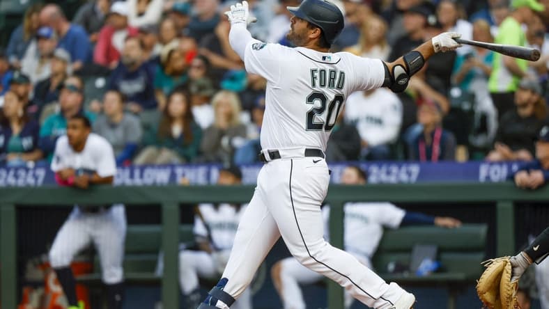 Jun 13, 2023; Seattle, Washington, USA; Seattle Mariners designated hitter Mike Ford (20) hits a two-run home run against the Miami Marlins during the fourth inning at T-Mobile Park. Mandatory Credit: Joe Nicholson-USA TODAY Sports