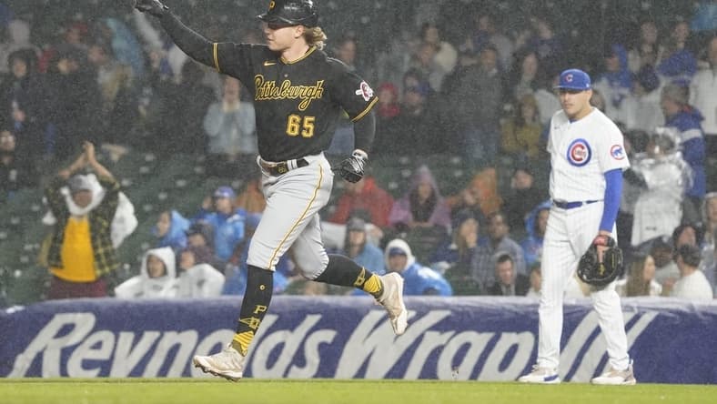 Jun 13, 2023; Chicago, Illinois, USA; Pittsburgh Pirates center fielder Jack Suwinski (65) runs the bases after hitting a home run against the Chicago Cubs during the sixth inning at Wrigley Field. Mandatory Credit: David Banks-USA TODAY Sports
