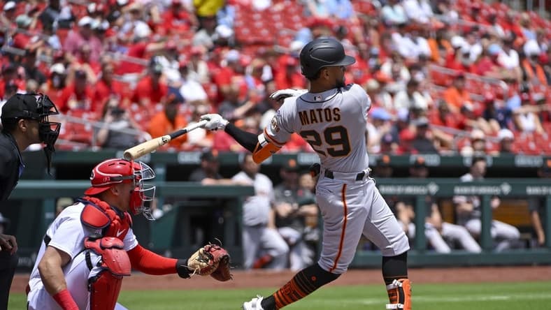 Jun 14, 2023; St. Louis, Missouri, USA; San Francisco Giants center fielder Luis Matos (29) hits a single in his Major League debut against the St. Louis Cardinals during the first inning at Busch Stadium. Mandatory Credit: Jeff Curry-USA TODAY Sports