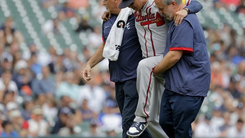 Jun 14, 2023; Detroit, Michigan, USA; Atlanta Braves relief pitcher Jesse Chavez (60) is helped off the field after he is hit by a batted ball in the sixth inning against the Detroit Tigers at Comerica Park. Mandatory Credit: Rick Osentoski-USA TODAY Sports