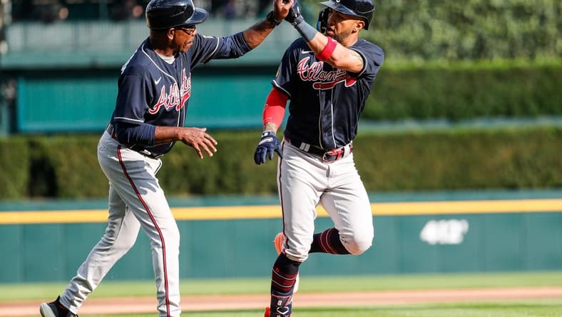 Atlanta Braves left fielder Eddie Rosario (8) celebrates with third base coach Ron Washington (37) after hitting a homer against the Detroit Tigers during the sixth inning of Game 2 of the doubleheader at Comerica Park in Detroit on Wednesday, June 14, 2023.