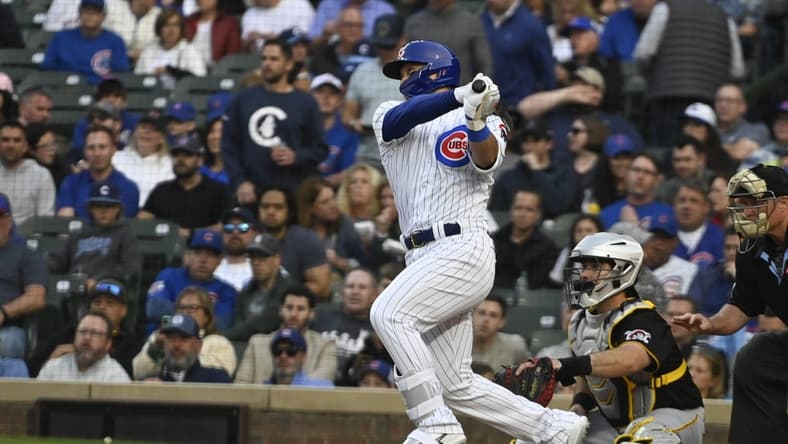 Jun 14, 2023; Chicago, Illinois, USA; Chicago Cubs right fielder Seiya Suzuki (27) singles during the first inning against the Pittsburgh Pirates at Wrigley Field. Mandatory Credit: Matt Marton-USA TODAY Sports