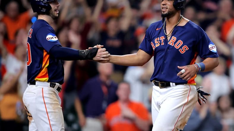 Jun 14, 2023; Houston, Texas, USA; Houston Astros first baseman Jose Abreu (79) is congratulated by Houston Astros right fielder Kyle Tucker (30) after crossing home plate for the winning run on a throwing error against the Washington Nationals during the ninth inning at Minute Maid Park. Mandatory Credit: Erik Williams-USA TODAY Sports