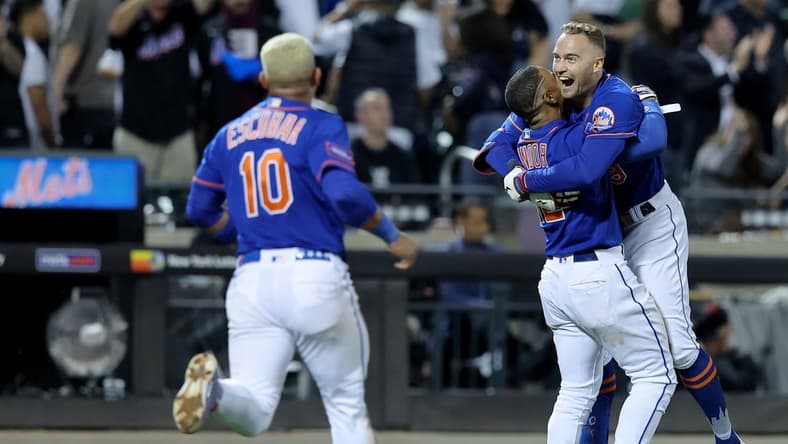 Jun 14, 2023; New York City, New York, USA; New York Mets center fielder Brandon Nimmo (9) celebrates with shortstop Francisco Lindor (12) and third baseman Eduardo Escobar (10) after hitting a tenth inning walkoff double against the New York Yankees at Citi Field. Mandatory Credit: Brad Penner-USA TODAY Sports