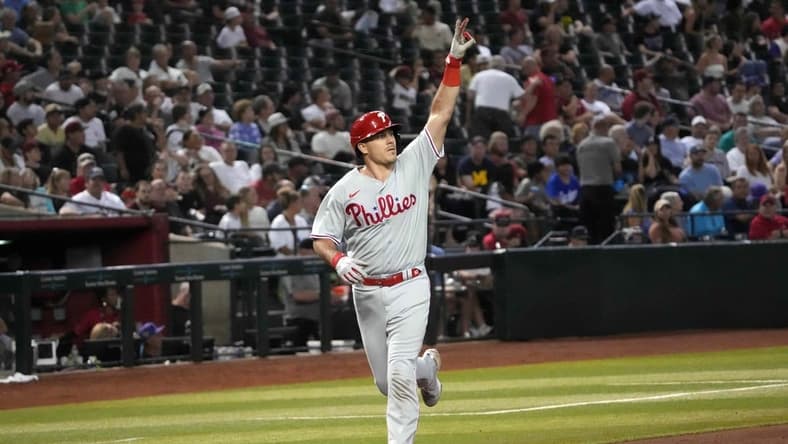 Jun 14, 2023; Phoenix, Arizona, USA; Philadelphia Phillies catcher J.T. Realmuto (10) celebrates after hitting a solo home run against the Arizona Diamondbacks during the sixth inning at Chase Field. Mandatory Credit: Joe Camporeale-USA TODAY Sports