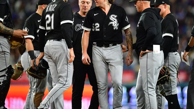 Jun 14, 2023; Los Angeles, California, USA; Chicago White Sox starting pitcher Mike Clevinger (52) reacts after suffering an apparent injury against the Los Angeles Dodgers/ during the fifth inning at Dodger Stadium. Mandatory Credit: Gary A. Vasquez-USA TODAY Sports