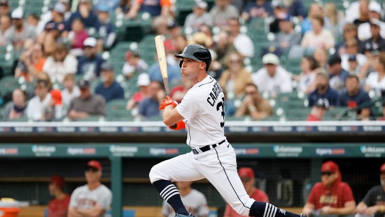 Jun 11, 2023; Detroit, Michigan, USA;  Detroit Tigers right fielder Kerry Carpenter (30) hits a single in the first inning against the Arizona Diamondbacks at Comerica Park. Mandatory Credit: Rick Osentoski-USA TODAY Sports