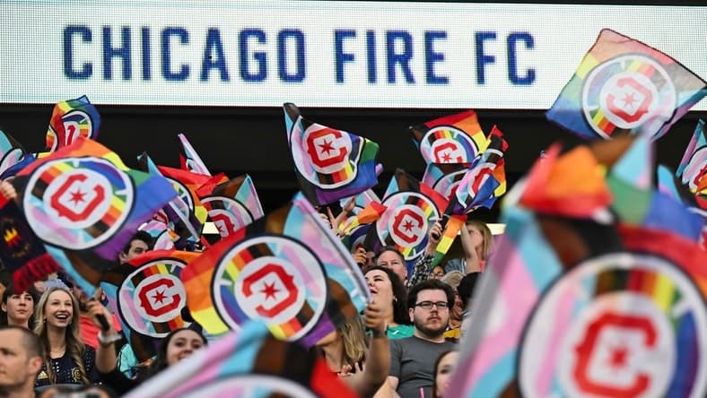 June 10, 2023; Chicago, Illinois, USA; Fans wave Pride flags before a match between the Chicago Fire FC and the Columbus Crew SC at Soldier Field. Mandatory Credit: Jamie Sabau-USA TODAY Sports