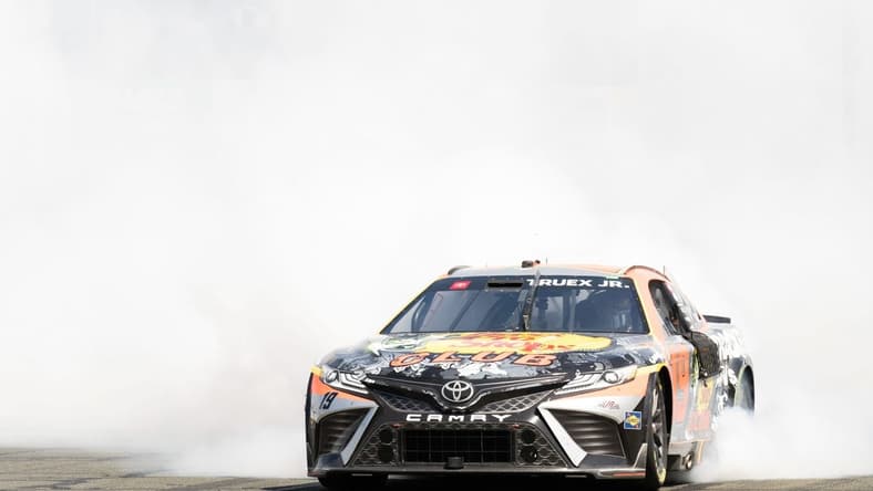 Jun 11, 2023; Sonoma, California, USA;  NASCAR Cup Series driver Martin Truex Jr. (19) celebrates after winning the Toyota / Save Mart 350 at Sonoma Raceway. Mandatory Credit: Stan Szeto-USA TODAY Sports