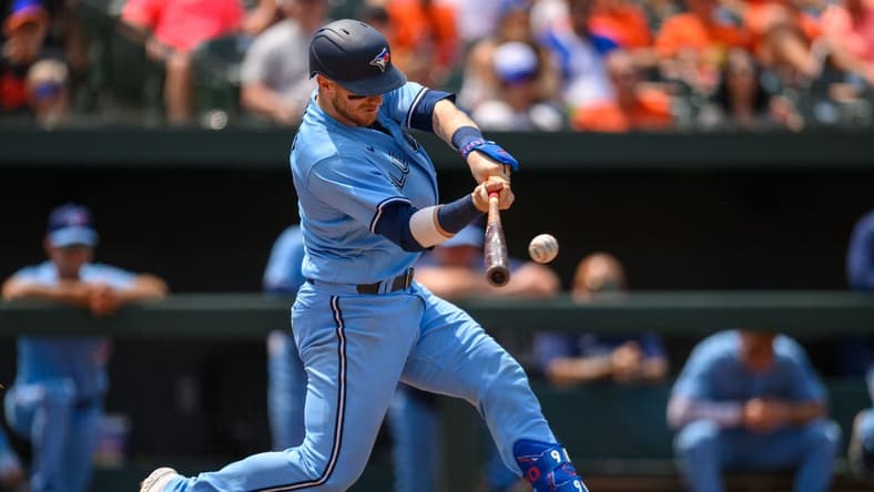 Jun 15, 2023; Baltimore, Maryland, USA; Toronto Blue Jays catcher Danny Jansen (9) hits a home run during the fifth inning against the Baltimore Orioles at Oriole Park at Camden Yards. Mandatory Credit: Reggie Hildred-USA TODAY Sports