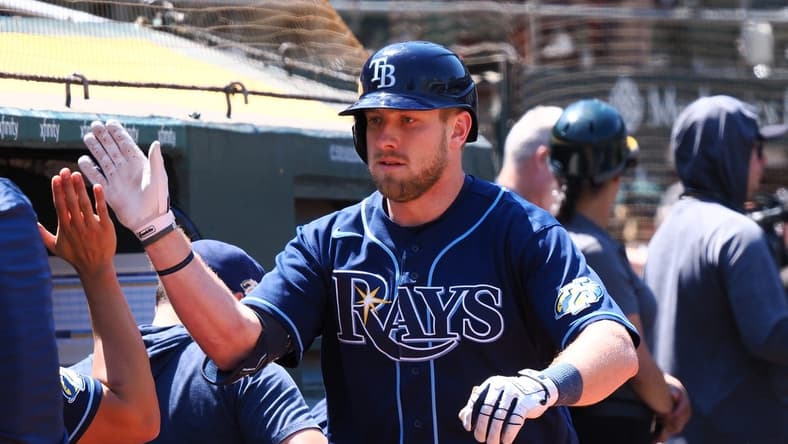 Jun 15, 2023; Oakland, California, USA; Tampa Bay Rays first baseman Luke Raley (55) high fives teammates after hitting a solo home run against the Oakland Athletics during the eighth inning at Oakland-Alameda County Coliseum. Mandatory Credit: Kelley L Cox-USA TODAY Sports