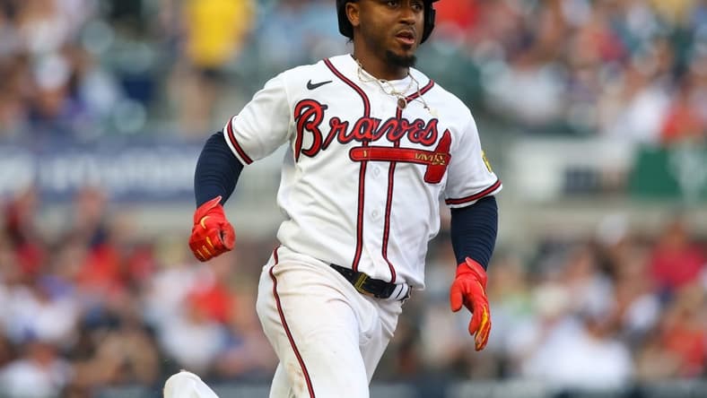 Jun 15, 2023; Atlanta, Georgia, USA; Atlanta Braves second baseman Ozzie Albies (1) hits a single against the Colorado Rockies in the first inning at Truist Park. Mandatory Credit: Brett Davis-USA TODAY Sports