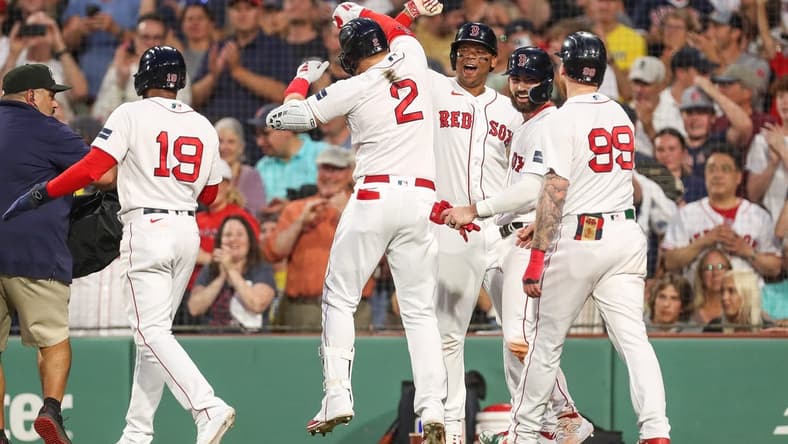 Jun 16, 2023; Boston, Massachusetts, USA; Boston Red Sox designated hitter Justin Turner (2) celebrates with teammates after hitting a grand slam during the third inning against the New York Yankees at Fenway Park. Mandatory Credit: Paul Rutherford-USA TODAY Sports