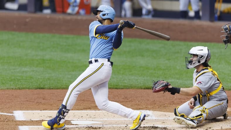 Jun 16, 2023; Milwaukee, Wisconsin, USA; Milwaukee Brewers right fielder Blake Perkins (16) hits an RBI single during the first inning against the Pittsburgh Pirates at American Family Field. Mandatory Credit: Jeff Hanisch-USA TODAY Sports