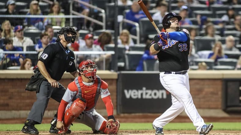 Jun 16, 2023; New York City, New York, USA; New York Mets designated hitter Daniel Vogelbach (32) hits a solo home run in the sixth inning against the St. Louis Cardinals at Citi Field. Mandatory Credit: Wendell Cruz-USA TODAY Sports