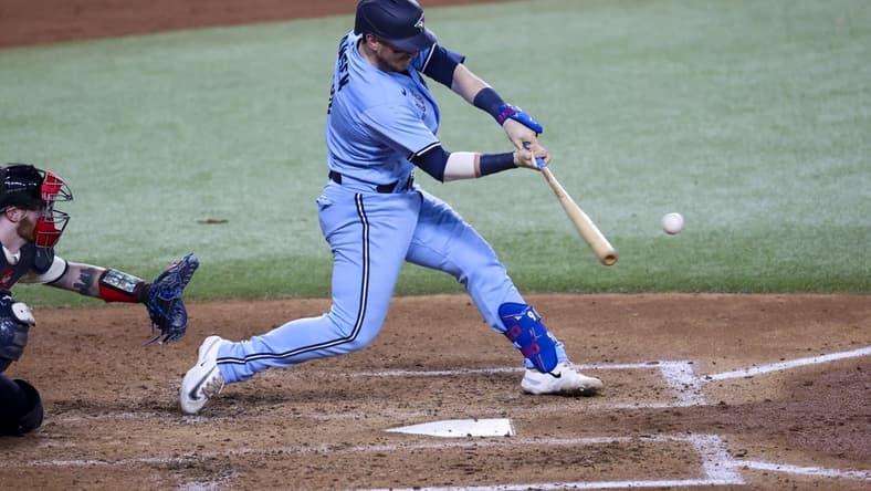 Jun 16, 2023; Arlington, Texas, USA; Toronto Blue Jays catcher Danny Jansen (9) hits a two-run home run during the fifth inning against the Texas Rangers at Globe Life Field. Mandatory Credit: Kevin Jairaj-USA TODAY Sports