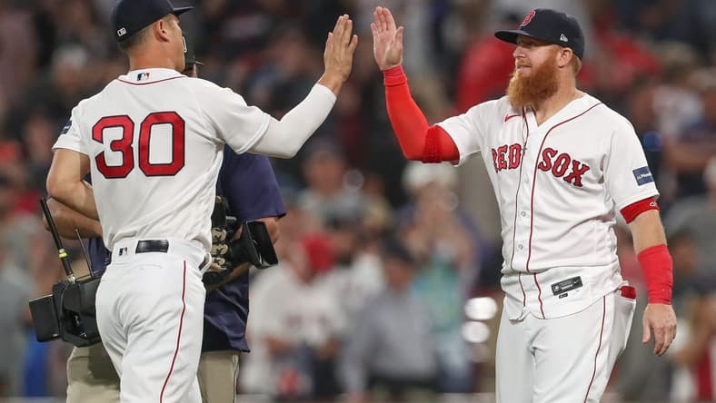 Jun 16, 2023; Boston, Massachusetts, USA; Boston Red Sox designated hitter Justin Turner (2) and Boston Red Sox left fielder Rob Refsnyder (30) celebrate after defeating the New York Yankees at Fenway Park. Mandatory Credit: Paul Rutherford-USA TODAY Sports